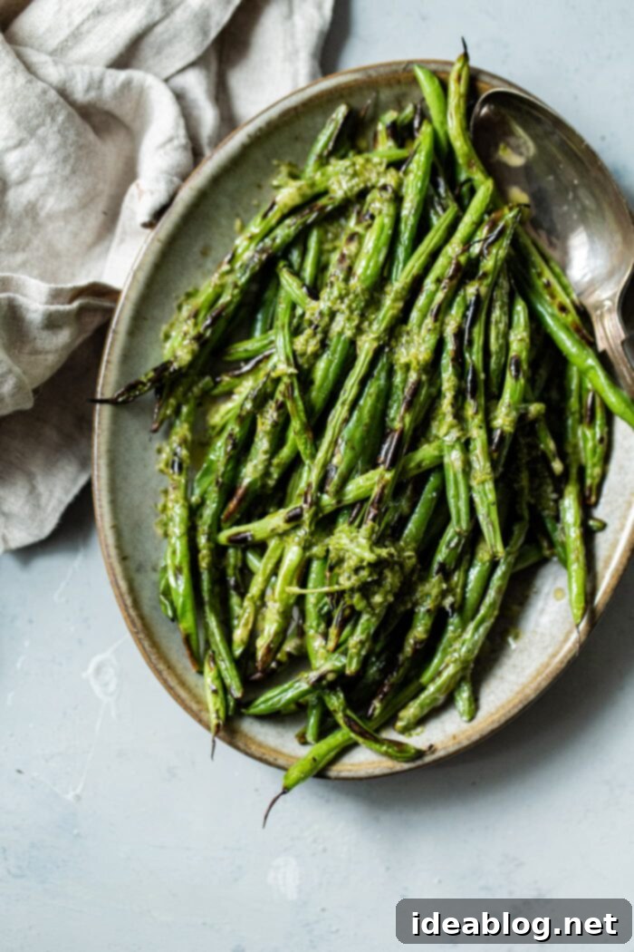 Fire-Kissed Green Beans with Zesty Cilantro Dressing 10 Platter of Charred Green Beans with Cilantro Vinaigrette, ready for serving.