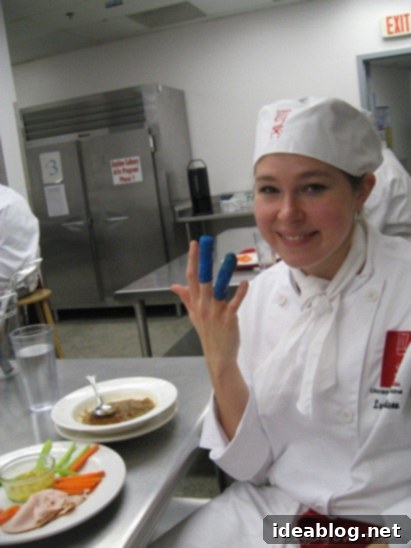 Day One: Mastering French Onion Soup 5 Student wearing a blue finger bandage after a cut