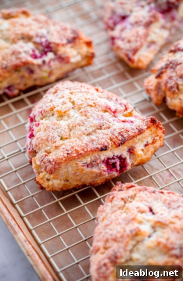 Bright Raspberry Pistachio Scones with Zesty Lemon Glaze 5 Close-up of Raspberry Pistachio Scones with Lemon Glaze