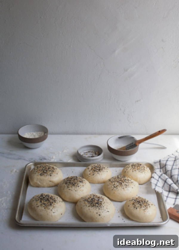 9 Everything Bagel Recipes to Obsess Over 4 Golden brown Homemade 'Everything' Hamburger Buns with sesame seeds