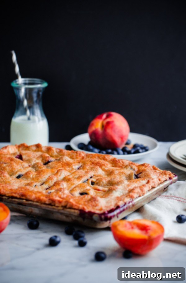 Golden Peach & Blueberry Slab Bake 5 Blueberry Peach Slab Pie cooling on a wire rack