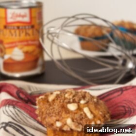 Spiced Pumpkin Muffins with Toasted Walnut Streusel 5 Close-up of a pumpkin muffin with walnut streusel topping