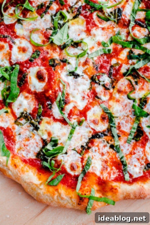 The BEST Homemade Margherita Pizza. Made in a standard kitchen oven! #pizza #margherita #abeautifulplate #recipe #italian Homemade Margherita Pizza Recipe with fresh toppings