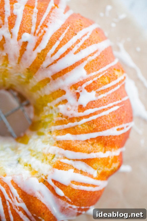 Cardamom Zucchini Bundt with Zesty Lemon Drizzle 2 Zucchini Cardamom Bundt Cake with Lemon Glaze, beautifully drizzled with glaze and ready to be served.