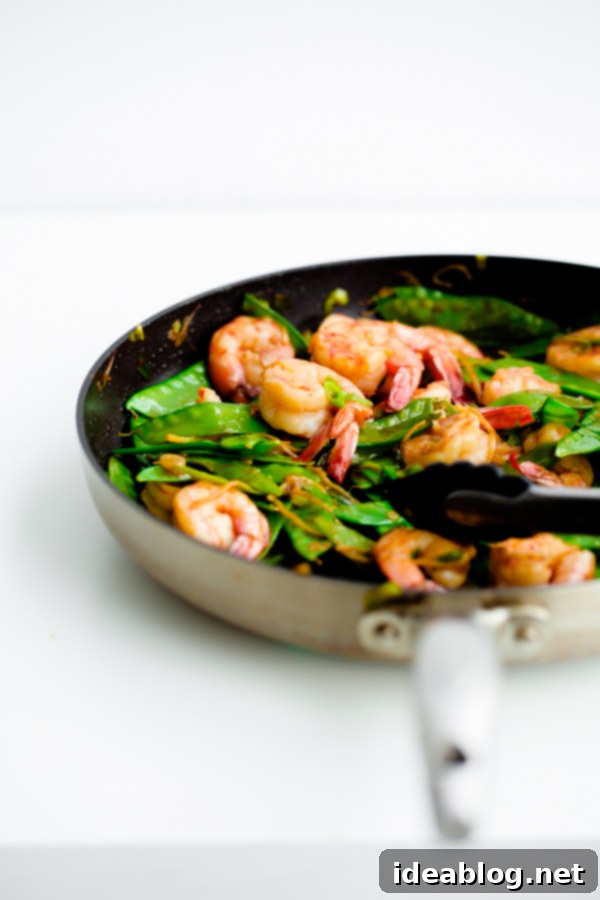 Lightning-Fast Shrimp and Snow Pea Stir Fry 6 Final plated 15-Minute Shrimp and Snow Pea Stir Fry with rice