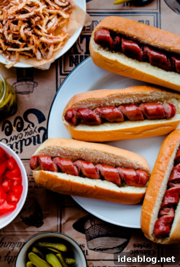 Chicago Hot Dogs Reinvented 5 Fancy Chicago-Style Hot Dogs topped with celery salt fried onions, Dijon mustard, cornichon, spicy sport peppers, and chopped tomato! Insanely delicious and easy tailgating food.