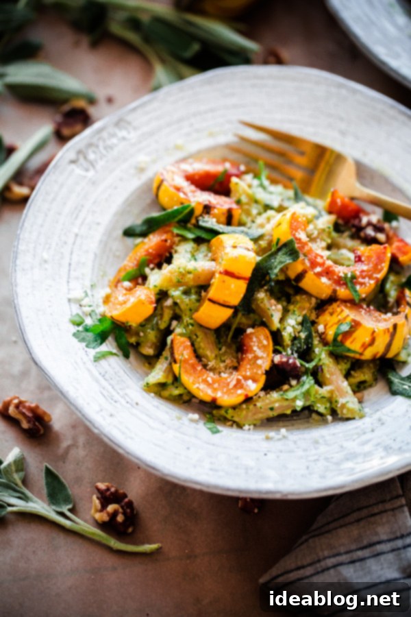 Irresistible Whole Wheat Pasta with Fragrant Walnut-Sage Pesto and Succulent Roasted Delicata Squash. A delicious, healthy, and easy vegetarian autumn pasta!