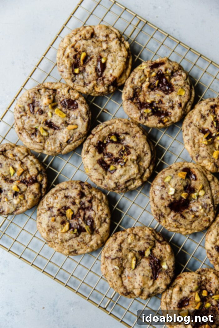 Zesty Orange Pistachio Chocolate Chunk Cookies 5 Warm Orange Pistachio Chocolate Chunk Cookies cooling on a rack