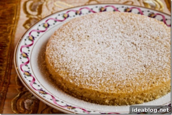 Spice & Celebrate: Buttermilk Birthday Cake 3 Close-up of a slice of buttermilk spice cake with pear compote and powdered sugar
