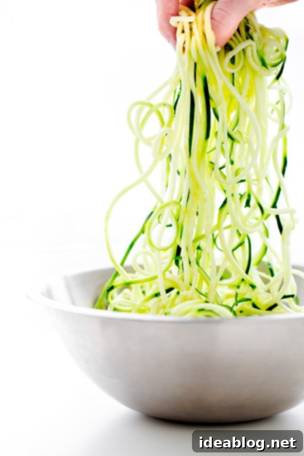 Zucchini Pasta with Garlic Clam Sauce. An EASY, healthy dinner recipe made with zucchini noodles. Less than 250 calories per serving! #abeautifulplate #glutenfree #clam #pasta #zoodles #recipe Freshly spiralized zucchini noodles ready for cooking