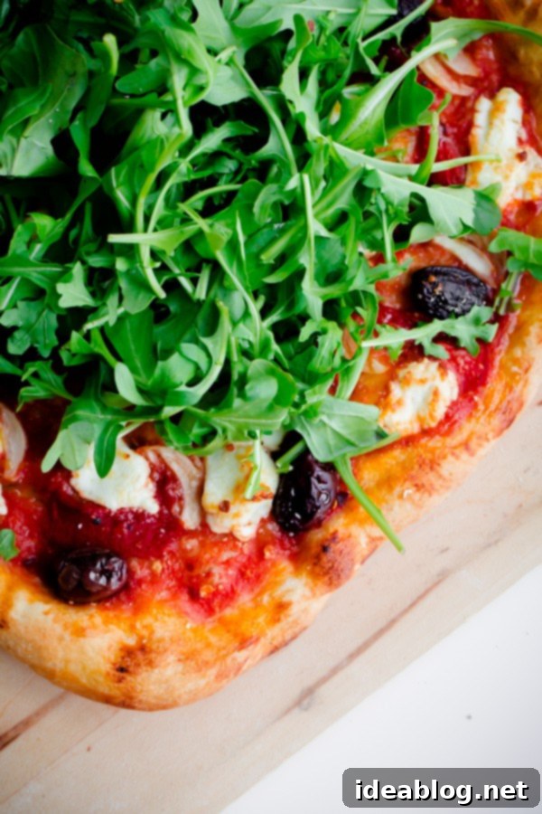 Goat Cheese & Arugula Inferno Pizza 5 Spicy Red Pepper, Goat Cheese, Olive, and Arugula Pizza
