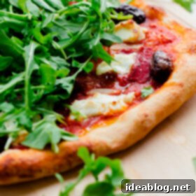 Goat Cheese & Arugula Inferno Pizza 6 Spicy Red Pepper, Goat Cheese, Olive, and Arugula Pizza
