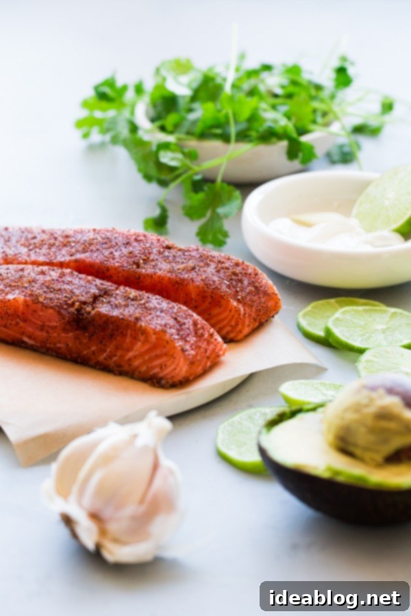 Brown Sugar and Chili Rubbed Salmon with Avocado Crema. An easy, delicious healthy dinner that comes together in less than 30 minutes!  Close up of Brown Sugar and Chili Rubbed Salmon