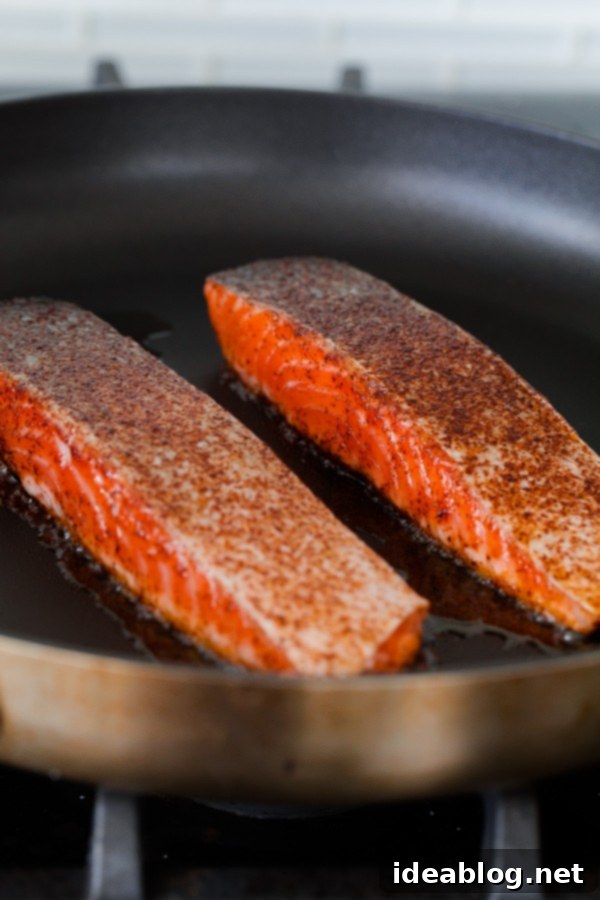 Brown Sugar and Chili Rubbed Salmon with Avocado Crema. An easy, delicious healthy dinner that comes together in less than 30 minutes!  Chili Salmon Fillets seasoned and ready for cooking