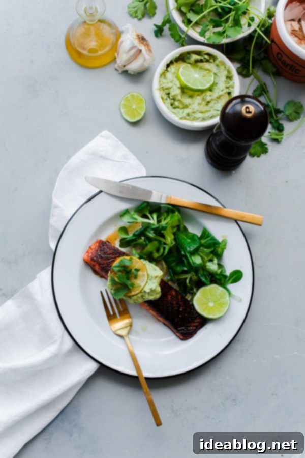 Brown Sugar and Chili Rubbed Salmon with Avocado Crema. An easy, delicious healthy dinner that comes together in less than 30 minutes!  Plated Brown Sugar and Chili Rubbed Salmon with Avocado Crema and caramelized lime