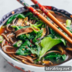 Umami-Rich Shiitake Spinach Miso Soup 2 A delicious bowl of vegan shiitake and spinach miso soup with soba noodles and fresh scallions.