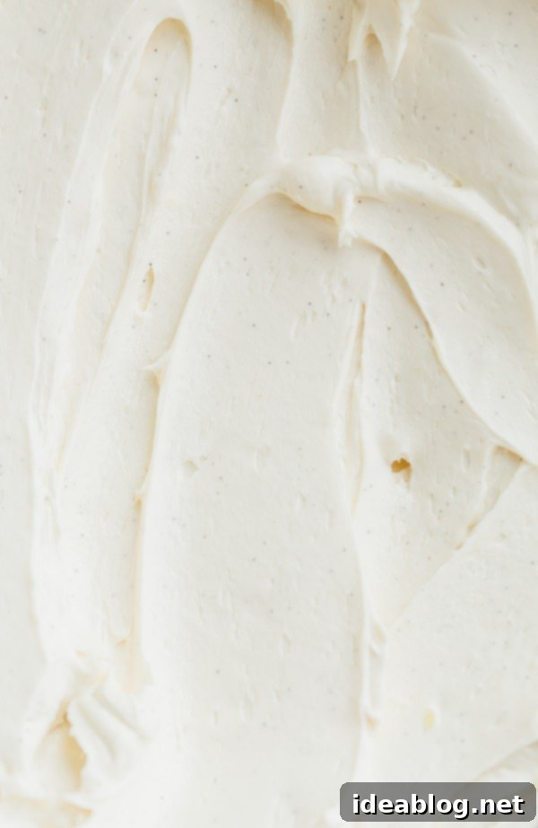 London Fog Dream Cake 6 Close-up of the delicate and fluffy Earl Grey Swiss Meringue Buttercream, showcasing its smooth texture and subtle tea flecks.
