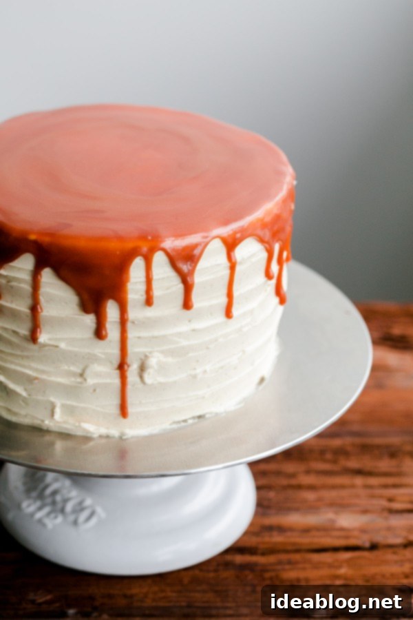 London Fog Dream Cake 7 A fork taking a bite from a slice of London Fog Cake, highlighting the layers and inviting texture.