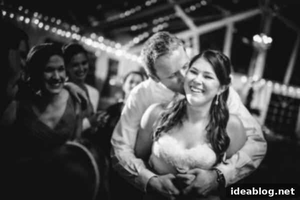 Our First Year of Marriage: 11 Superlative Moments 6 Another favorite wedding photo, a candid shot of the couple laughing joyfully on their wedding day.