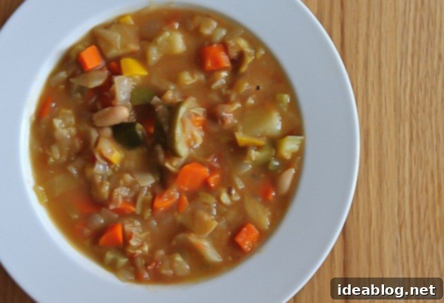 Soul-Soothing Winter Minestrone 2 A hearty bowl of winter minestrone soup, brimming with colorful vegetables and a rich broth, perfect for a cold day.