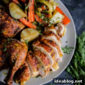 Aromatic Spiced Middle Eastern Chicken & Veggie Bake 10 Middle Eastern Roast Chicken on a platter with roasted vegetables.