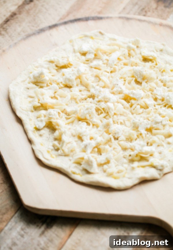 Lemon Truffle Arugula Pizza. A cheese pizza topped with a lemon truffle oil arugula salad! This elegant simple homemade pizza is a crowd favorite!  Cheese Pizza