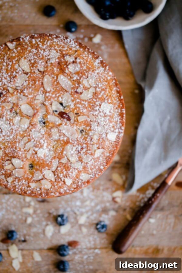 Artisan Blueberry Almond Tea Cake 5 Overhead shot of the entire Blueberry Almond Tea Cake with a dusting of powdered sugar.
