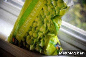 Vibrant Green Lima Bean, Zucchini, and Spinach Soup 9 Blending soup with an immersion blender