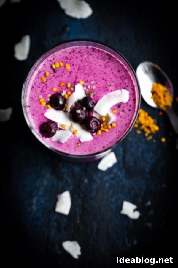 Simple Berry Smoothie - made with greek yogurt, frozen berries, coconut water, and my favorite smoothie addition: almond buttter.  Simple Berry Smoothie - a vibrant, healthy blend made with Greek yogurt, frozen berries, coconut water, and a secret ingredient: almond butter.