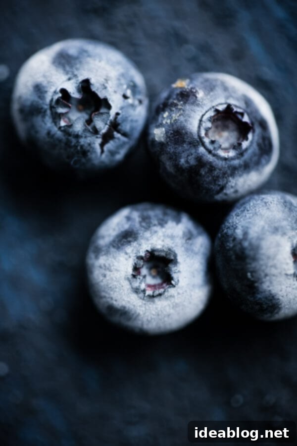 Frozen Blueberries Freshly frozen blueberries ready for blending into a healthy smoothie.