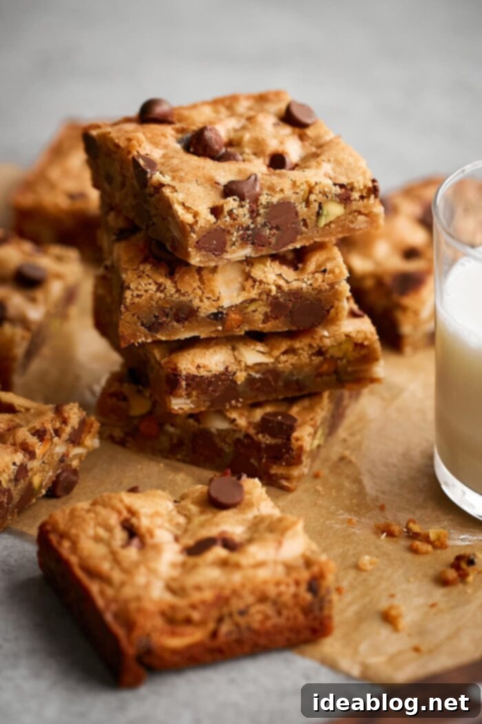 Effortless Blondies Endless Flavor Twists 2 Stack of Golden Brown Chocolate Chip Blondies, highlighting their thick and chewy texture, ready to be enjoyed.