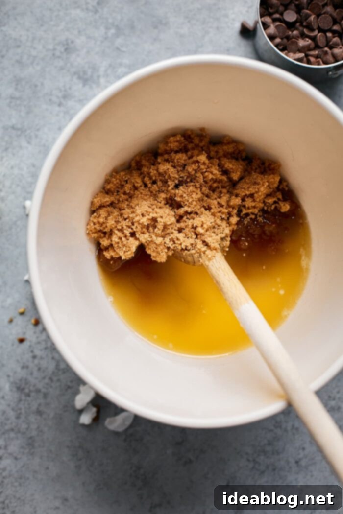 Effortless Blondies Endless Flavor Twists 5 Smooth blondie batter in a mixing bowl after combining wet ingredients.