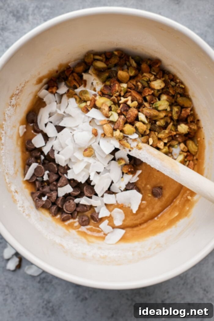 Effortless Blondies Endless Flavor Twists 7 Blondie batter smoothed into a baking pan, ready for the oven.