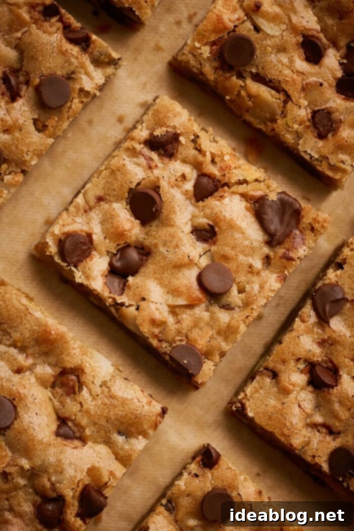 Effortless Blondies Endless Flavor Twists 8 Perfectly sliced blondie bars, showing their rich, dense, and chewy interior with melted chocolate chips.