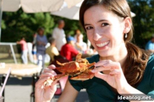 Crab Feast, Autumnal Pumpkins and Sweet Gelato Indulgence 4 Caroline Davis smiling, posing with food at the crab feast, enjoying the moment