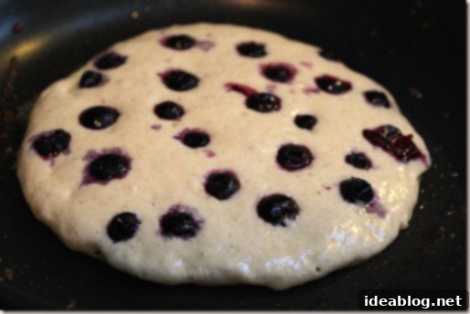 Wholesome Blueberry Quinoa Pancakes 3 Close-up of Blueberry Quinoa Pancakes cooking on a griddle, showing blueberries