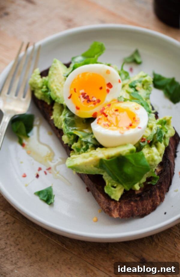 Fancy Avocado Toast - chunky avocado with lemon, chili flakes, basil - topped with a soft boiled egg! Fancy Avocado Toast with Egg