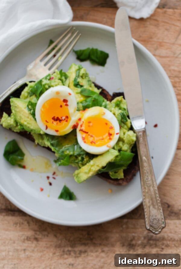 Fancy Avocado Toast - chunky avocado with lemon, chili flakes, basil - topped with a soft boiled egg! Fancy Avocado Toast with Egg