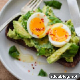 Elevated Avocado Toast 4 Fancy Avocado Toast - chunky avocado with lemon, chili flakes, basil - topped with a soft boiled egg!