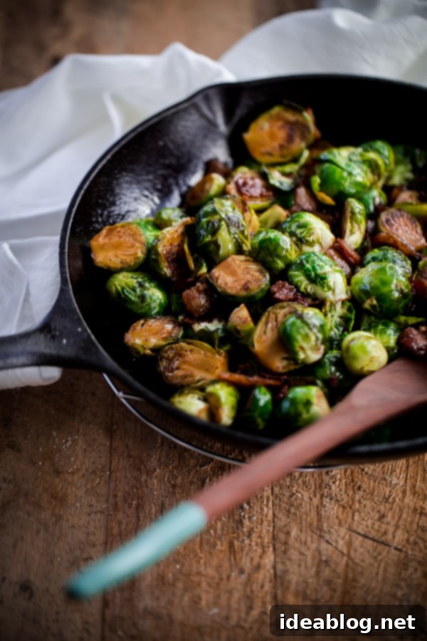 Caramelized Maple Bacon Brussels Sprouts 7 Close-up of Maple Bacon Brussels Sprouts, showcasing crispy bacon and caramelized edges.