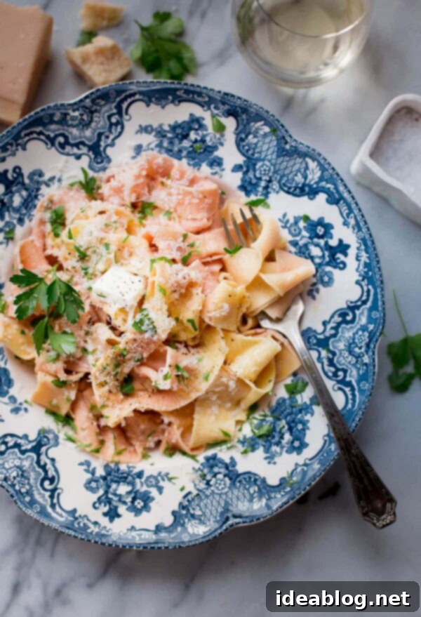 Homemade Pappardelle Pasta - a simple traditional egg pasta dough recipe made with all-purpose flour, semolina, and eggs! Made traditionally or naturally colored (pink!) with beet puree. #pasta #recipe #pappardelle #homemade #italian #abeautifulplate Homemade Pappardelle Pasta, a simple traditional egg pasta dough recipe made with all-purpose flour, semolina, and eggs, optionally colored pink with beet puree.