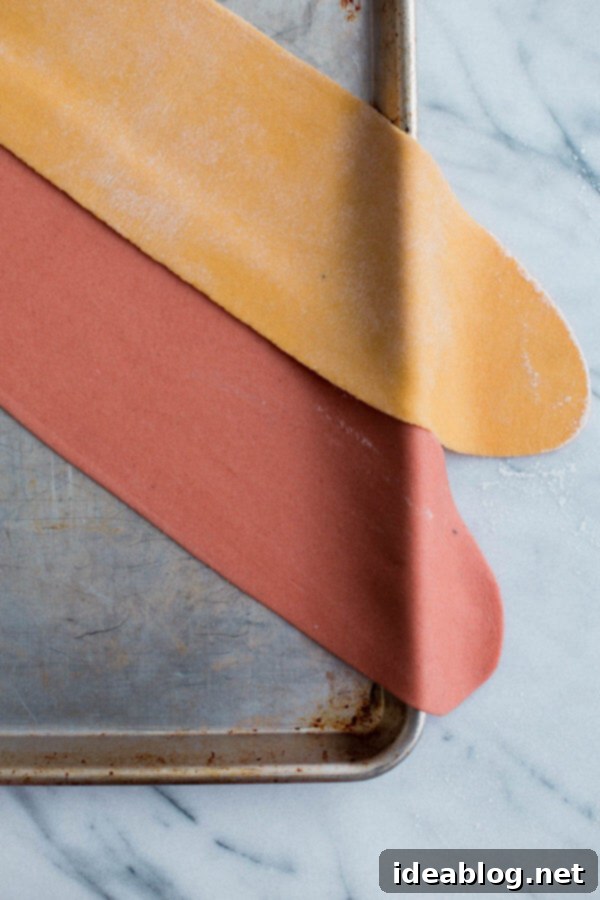 Homemade Pappardelle Pasta - a simple traditional egg pasta dough recipe made with all-purpose flour, semolina, and eggs! Made traditionally or naturally colored (pink!) with beet puree. #pasta #recipe #pappardelle #homemade #italian #abeautifulplate Homemade Pappardelle Pasta