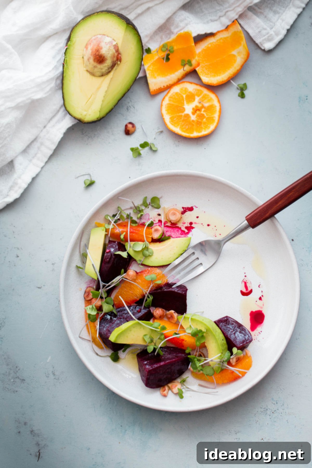 Roasted Beet Salad with Orange and Avocado. An EASY healthy salad recipe packed with healthy fats, texture, and nutrition! Roasted Beet Salad with Citrus and Avocado, garnished with microgreens
