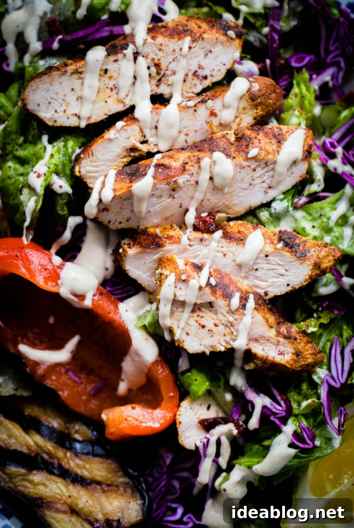 Zesty Mediterranean Chicken Salad with Sumac 6 AMAZING Mediterranean Chicken Salad with Sumac Dressing. This salad is packed with flavor and is topped with tahini dressing!