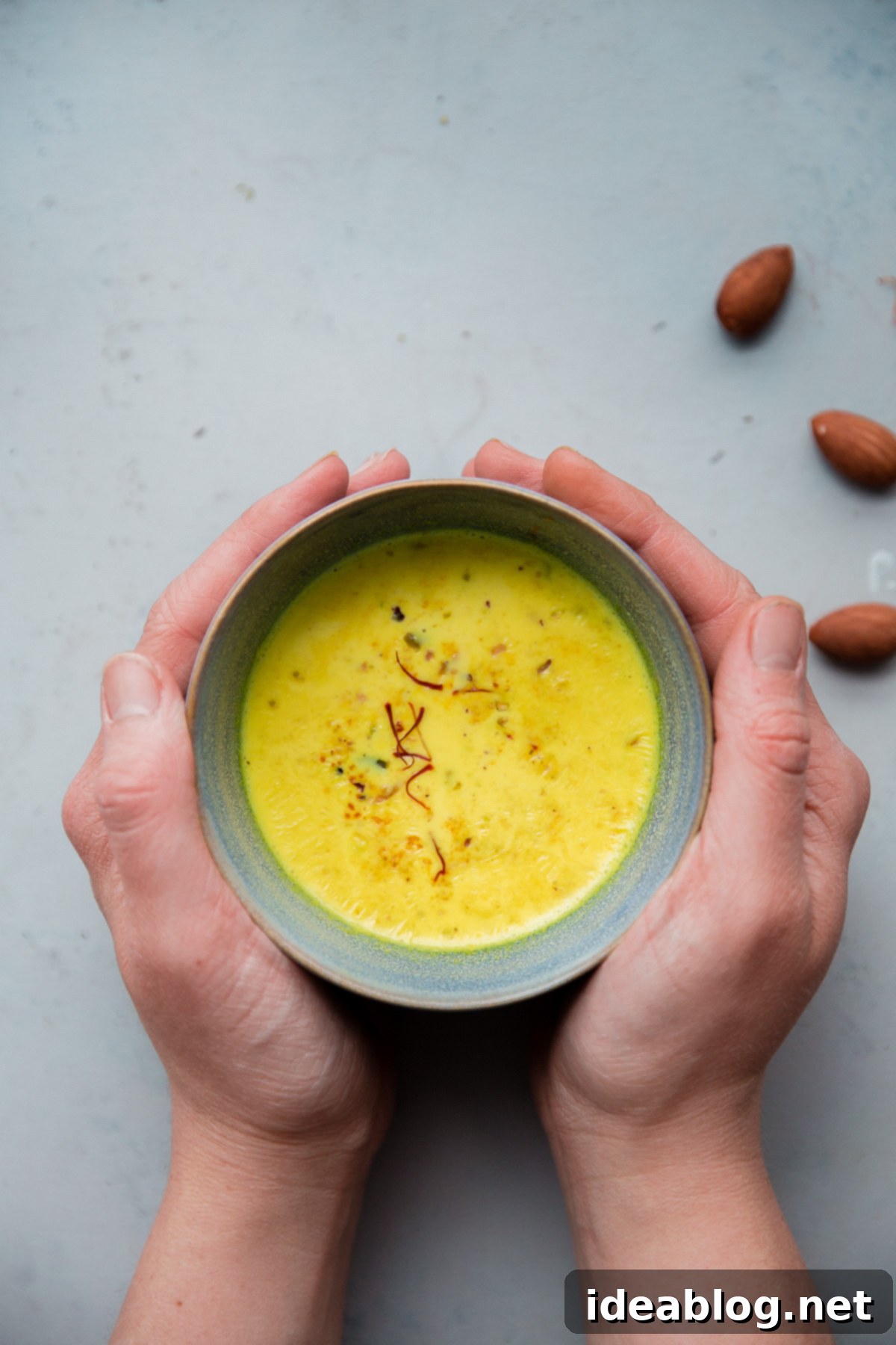 Turmeric Almond Milk - a lightly sweetened warm drink made from turmeric, almonds, and milk and infused with saffron and cardamom! Turmeric Almond Milk Recipe