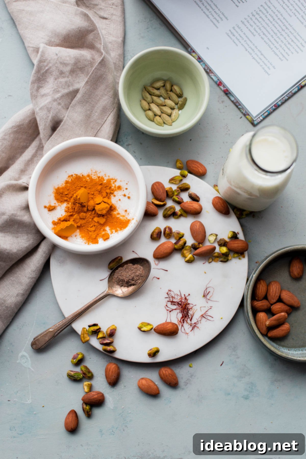 Turmeric Almond Milk - a lightly sweetened warm drink made from turmeric, almonds, and milk and infused with saffron and cardamom! Turmeric Almond Milk