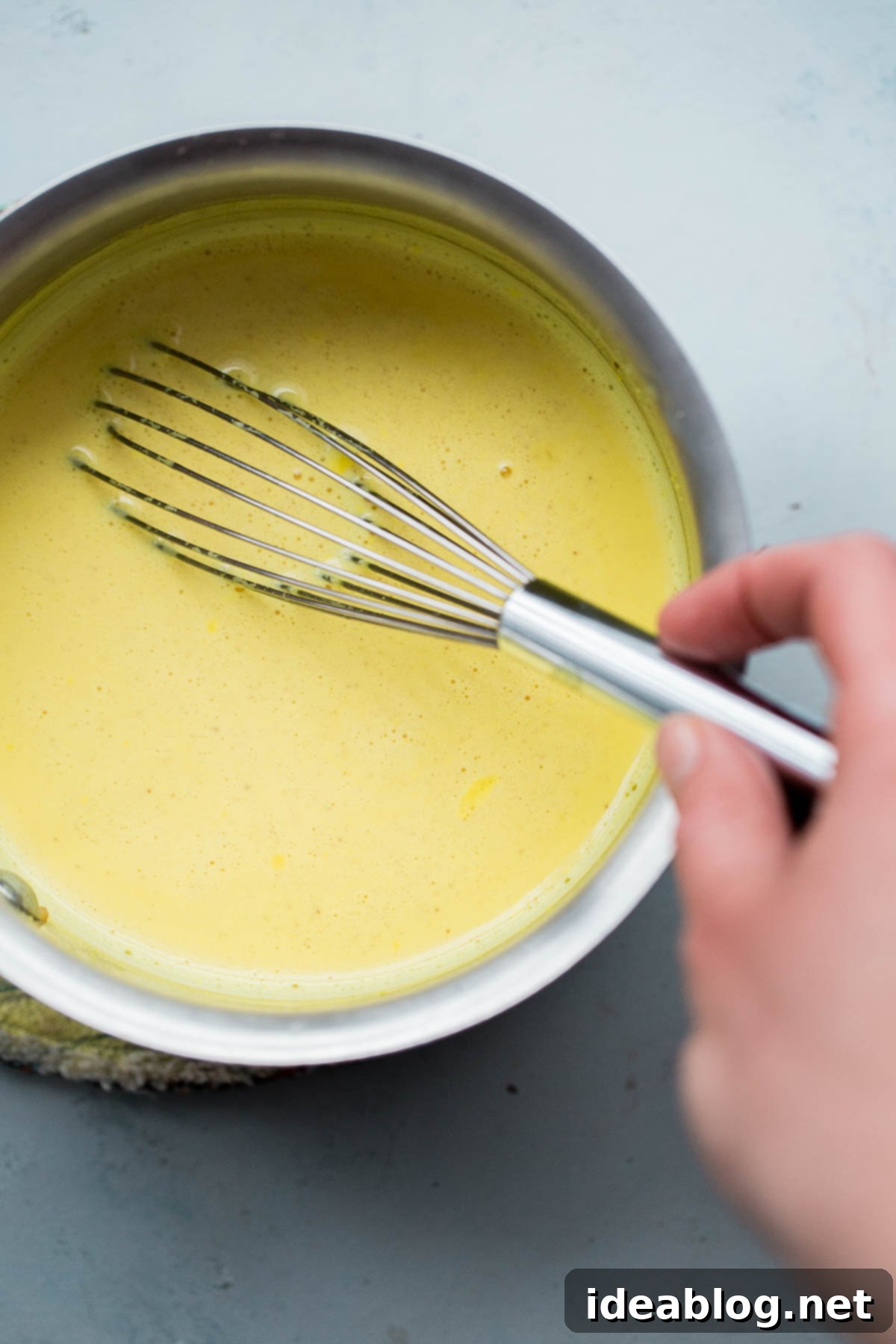 Turmeric Almond Milk - a lightly sweetened warm drink made from turmeric, almonds, and milk and infused with saffron and cardamom! Turmeric Milk in Saucepan