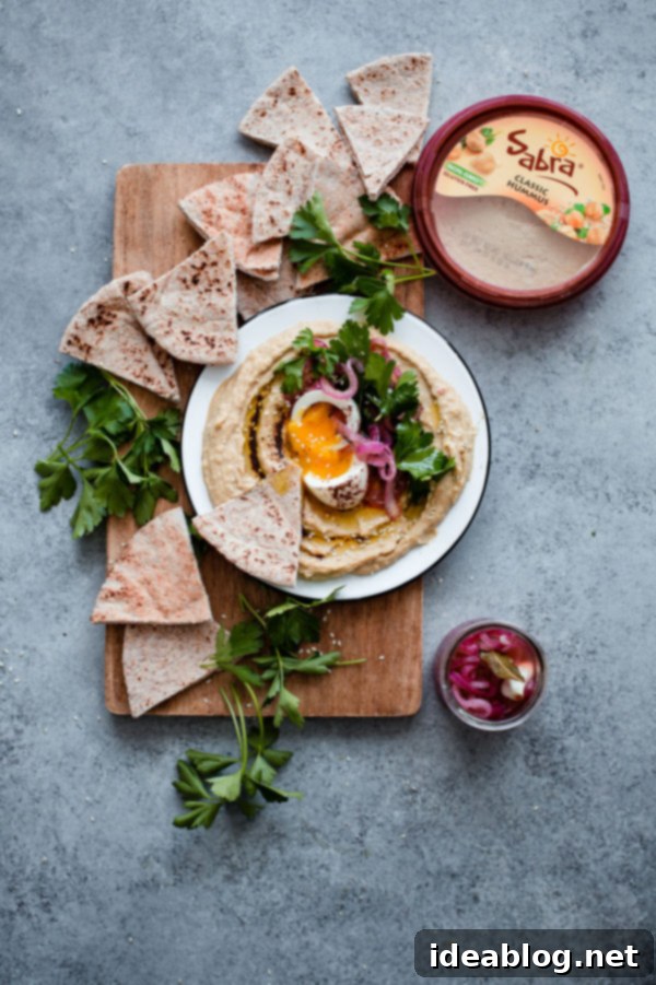 Gourmet Hummus with Jammy Egg and Sumac Kissed Onions 4 Hummus with Soft Boiled Egg, Pickled Onion, Parsley, and Sumac Oil