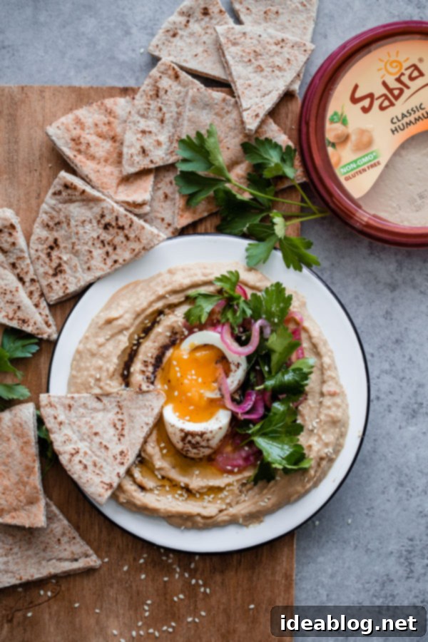 Gourmet Hummus with Jammy Egg and Sumac Kissed Onions 6 Hummus with Soft Boiled Egg, Pickled Onion, Parsley, and Sumac Oil