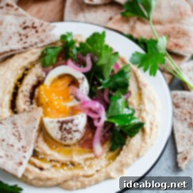Gourmet Hummus with Jammy Egg and Sumac Kissed Onions 7 Hummus with Soft Boiled Egg, Pickled Onion, Parsley, and Sumac Oil